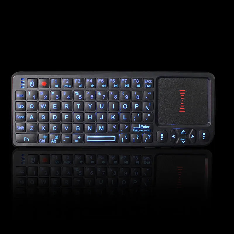Black wireless laser teaching mini keyboard with touch screen and backlit keys on a desk.