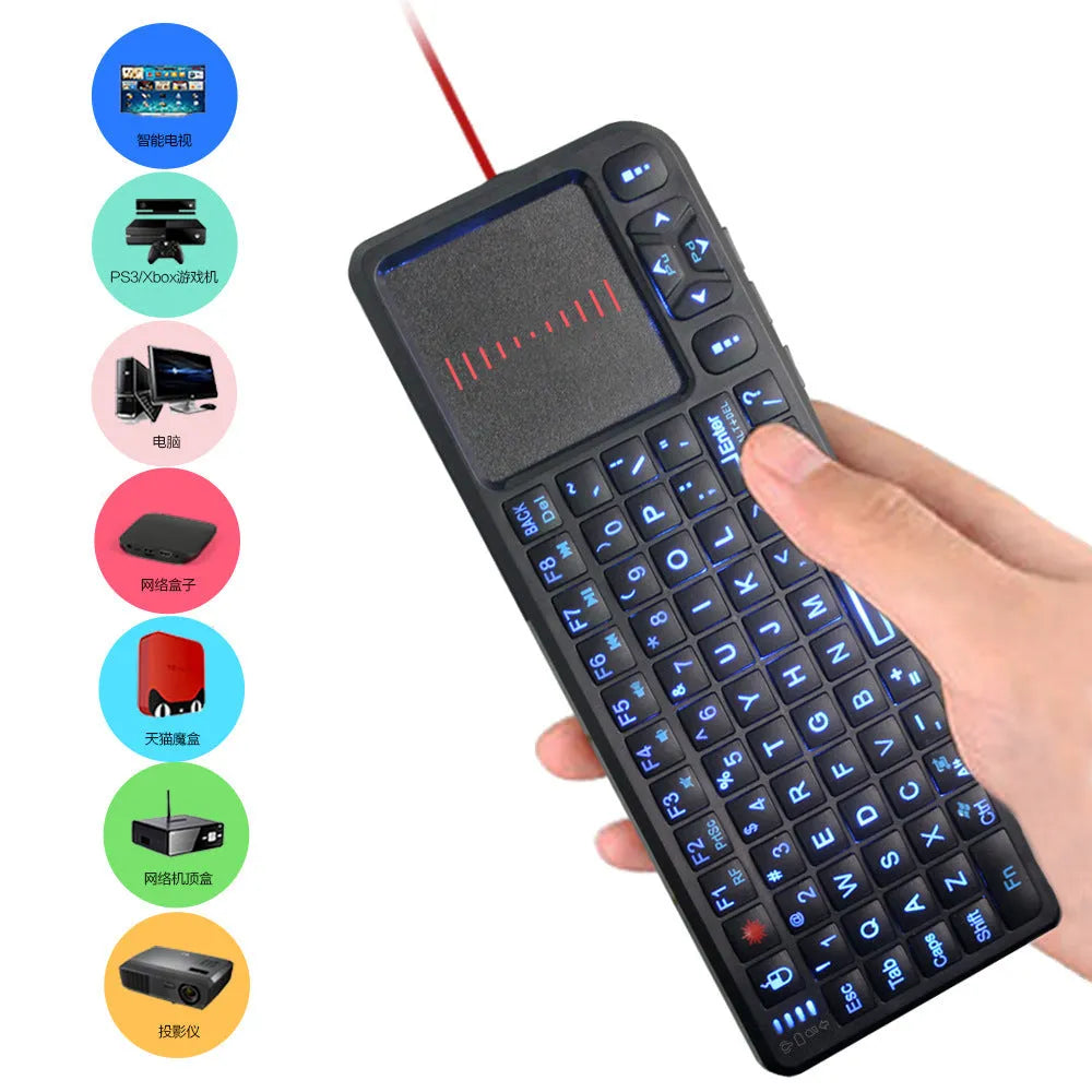 Black wireless laser teaching mini keyboard with touch screen and backlit keys on a desk.