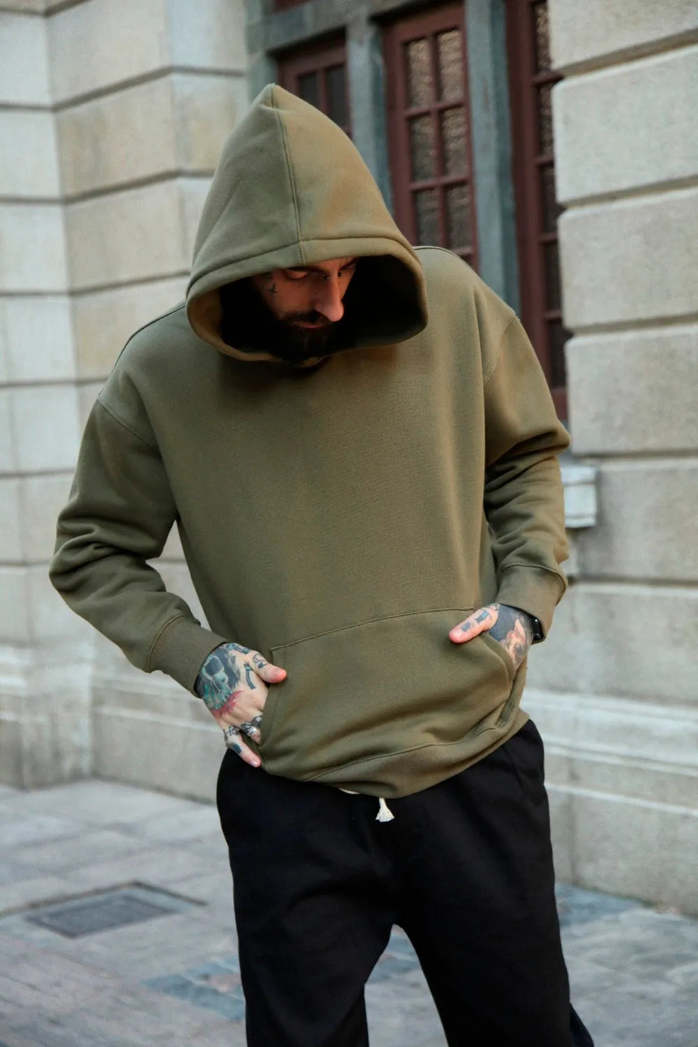 Men's oversize cotton hooded sweater in khaki, front view, hip-hop style with regular sleeves and hood