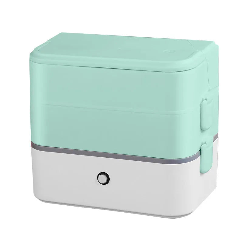 Pink and white double-layer pluggable heated lunch box with stainless steel interior and push-button controls.