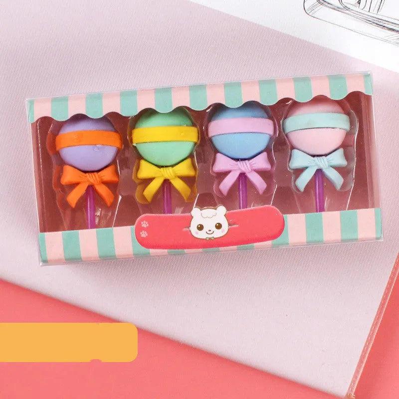 Set of twelve colourful cartoon food-shaped erasers including ice creams, doughnuts, and lollipops.