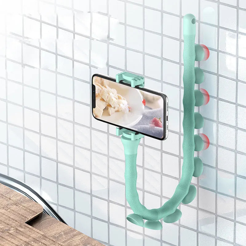 Flexible rubber phone holder with suction cup base showing 360 degree rotation capability