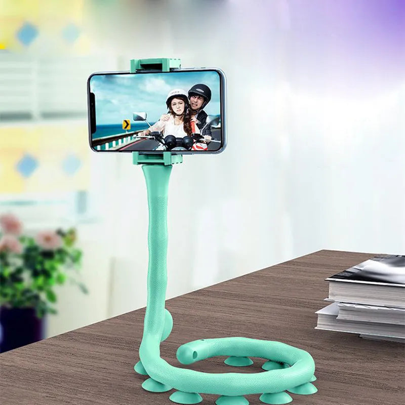 Flexible rubber phone holder with suction cup base showing 360 degree rotation capability