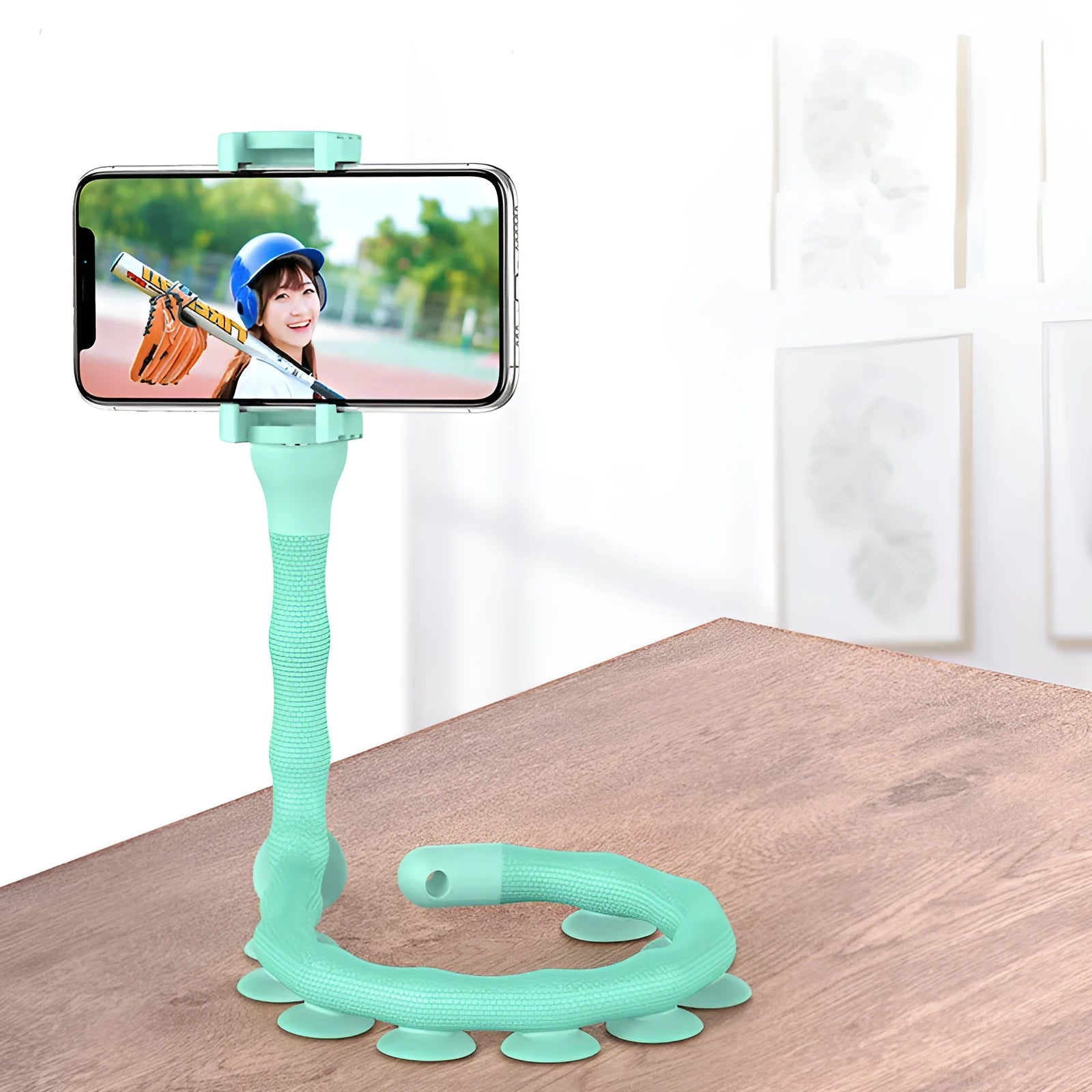 Flexible rubber phone holder with suction cup base showing 360 degree rotation capability