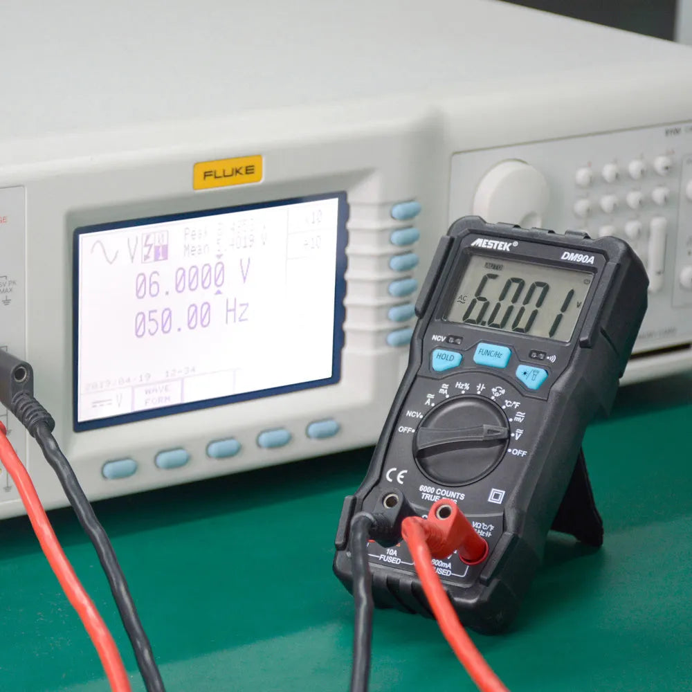 DM90A digital multimeter with LCD display showing measurement readings