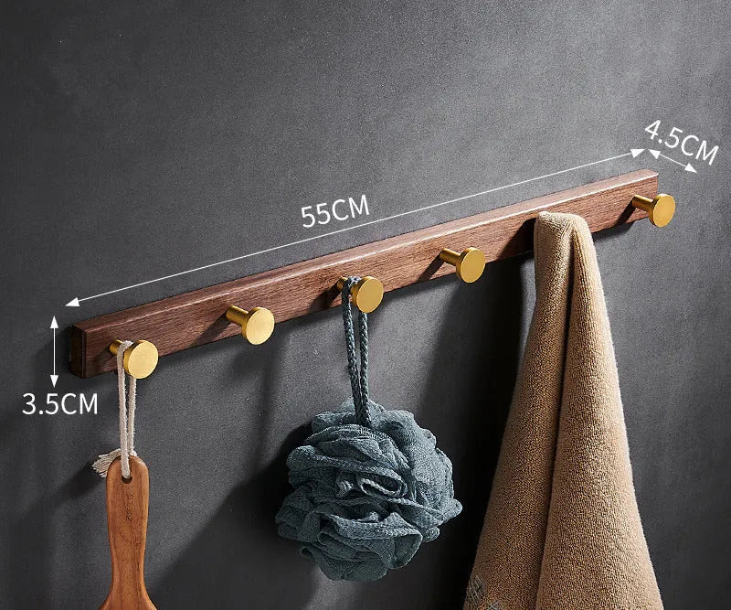 Black walnut aluminium bathroom hook rail with brass finish and multiple hooks for towel storage