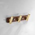 Black walnut aluminium bathroom hook rail with brass finish and multiple hooks for towel storage