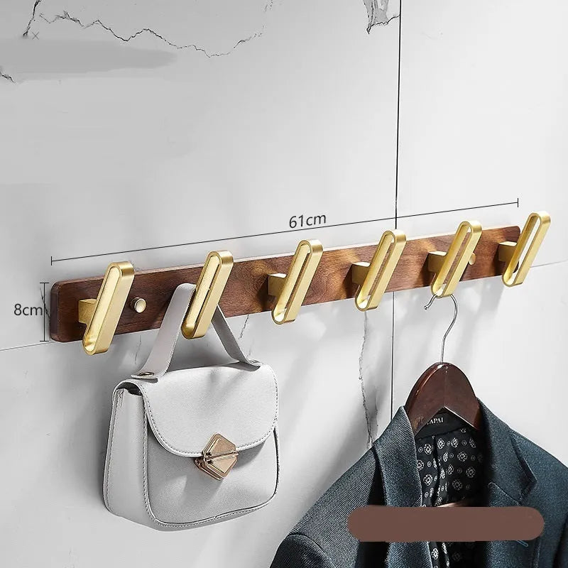 Black walnut aluminium bathroom hook rail with brass finish and multiple hooks for towel storage