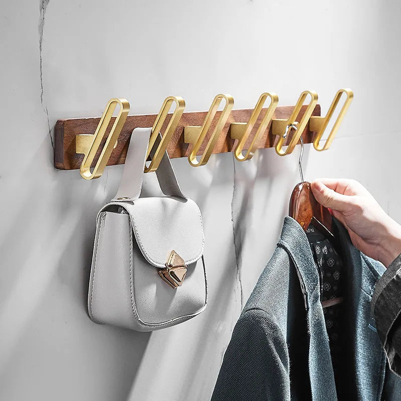 Black walnut aluminium bathroom hook rail with brass finish and multiple hooks for towel storage