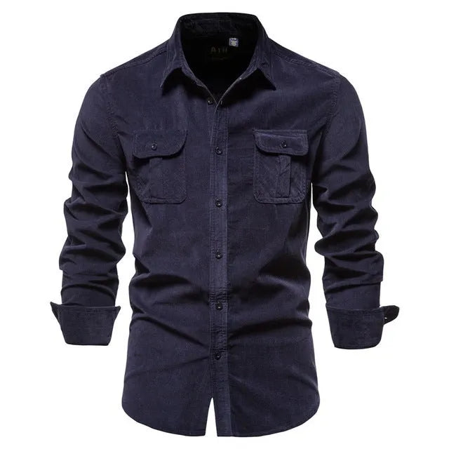 Men's long sleeve linen shirt in Denim Blue on a hanger, showing button front and smart casual style.