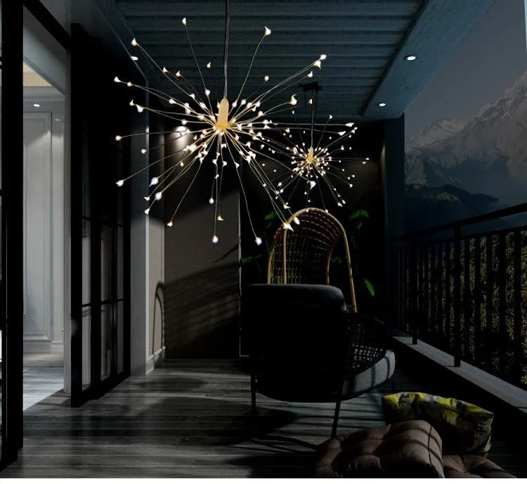 Solar-powered LED meteor shower firework light hanging outdoors with warm white lights.