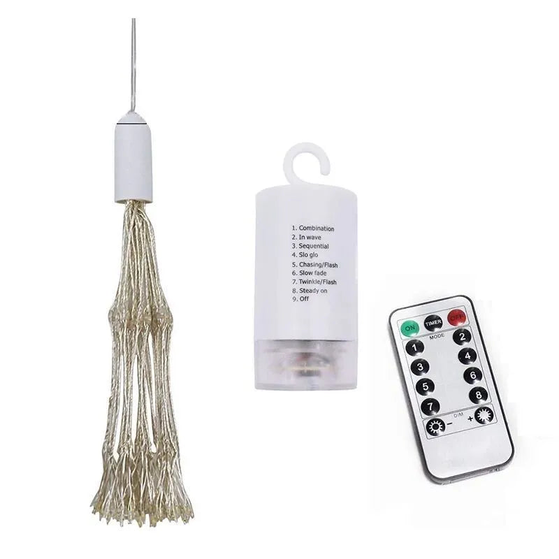 Solar-powered LED meteor shower firework light hanging outdoors with warm white lights.