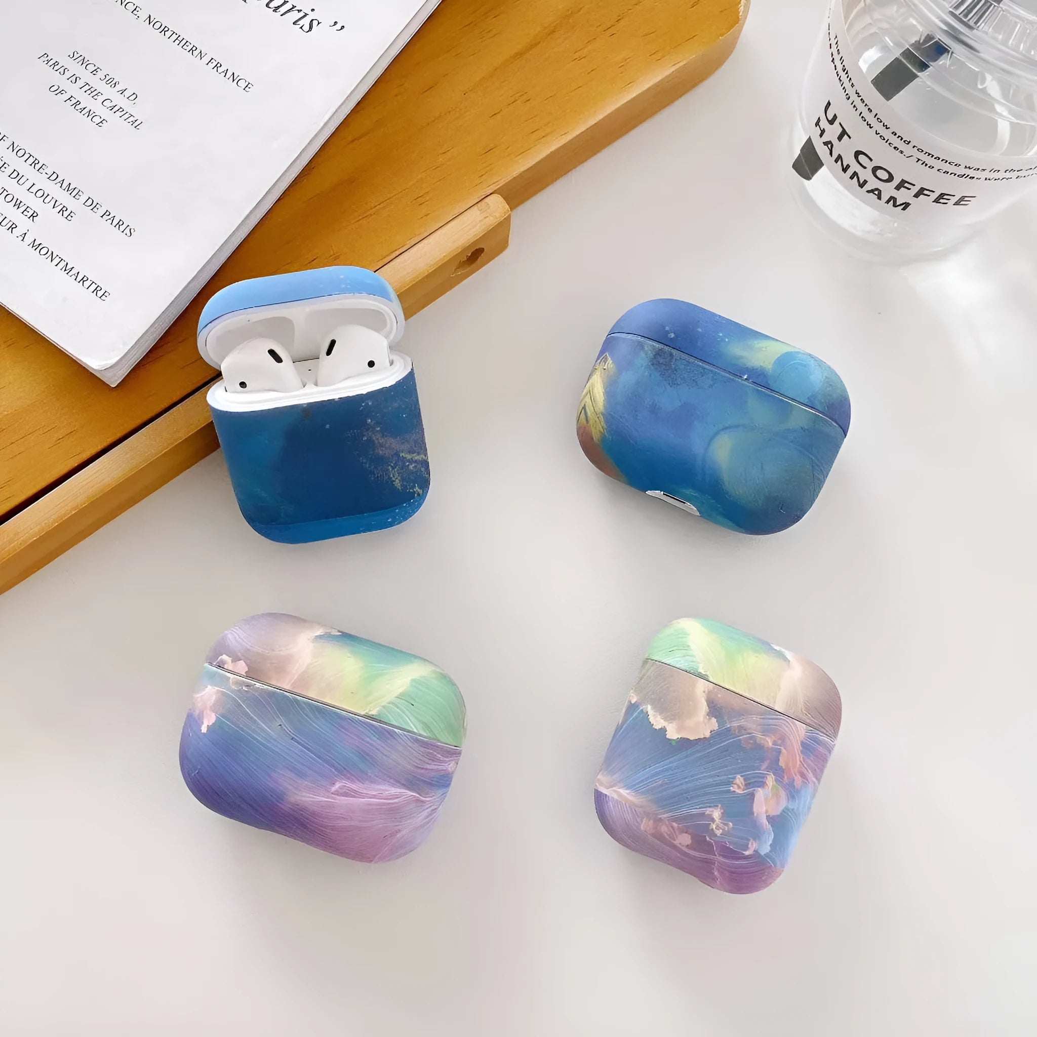 Hard plastic protective sleeve for Apple AirPods in pink and blue watercolour designs