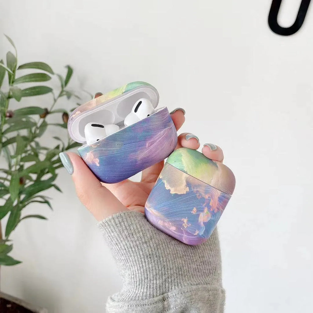 Hard plastic protective sleeve for Apple AirPods in pink and blue watercolour designs
