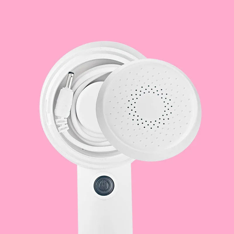 White rechargeable clothes shaver and beater on a plain background.