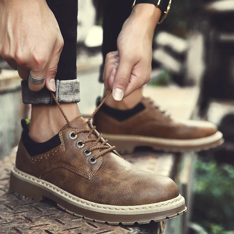 Men's black casual shoes with round toe and front-tie lacing on rubber soles
