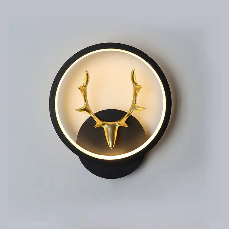 Nordic deer antler shaped wall lamp with remote control on a white wall.