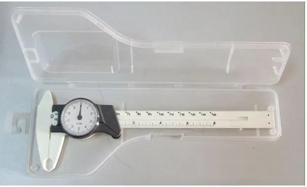 Black and white plastic vernier caliper showing 0-150mm measurement scale with stainless steel components