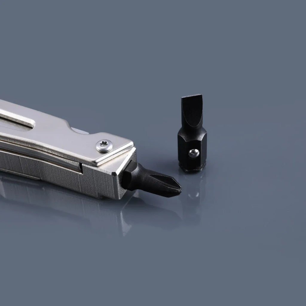White stainless steel multi-function tool showing integrated wrench, knife blade, and needle nose pliers.