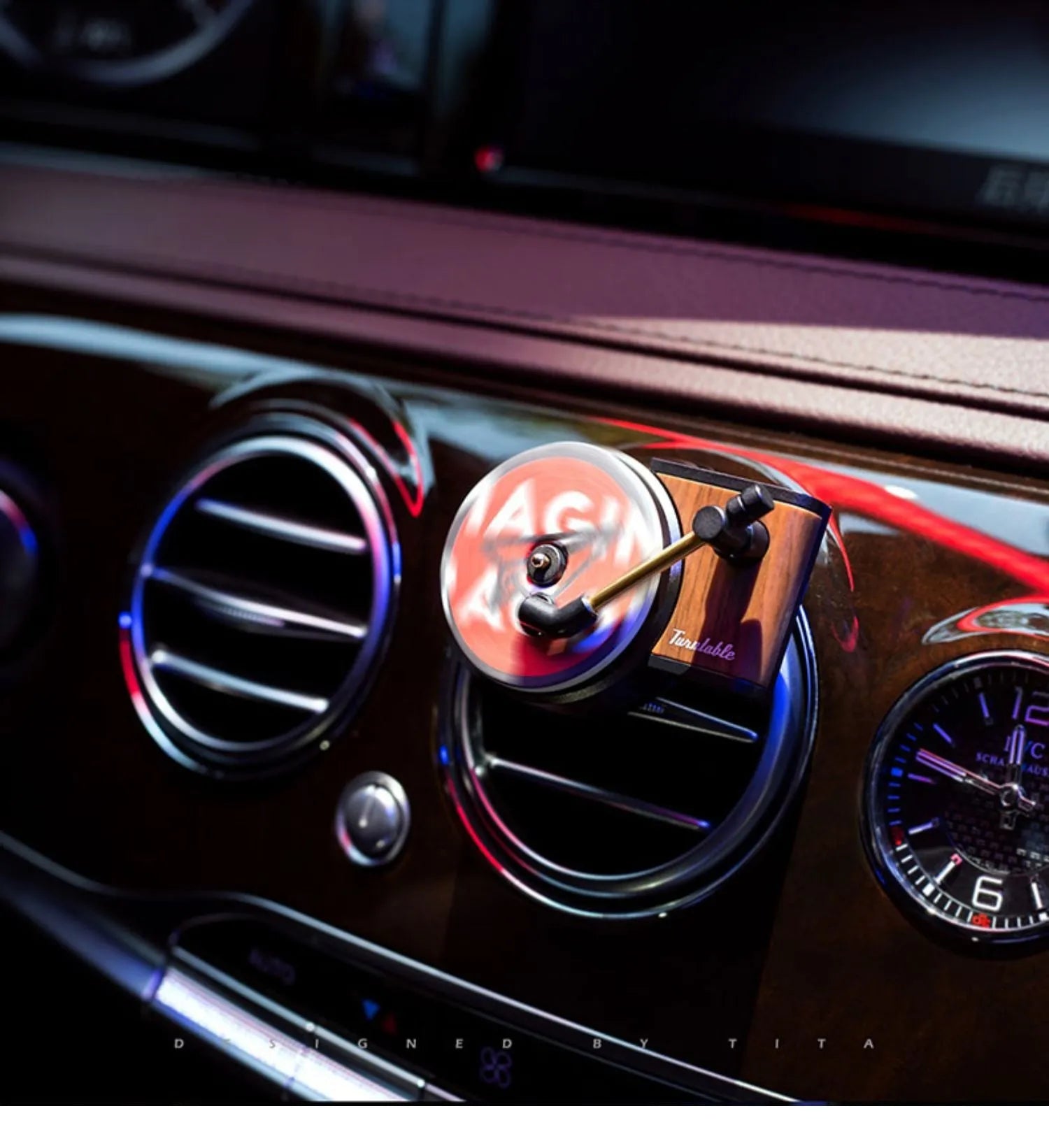 Brown alloy solid car perfume with record locomotive design clipped to a car air vent.