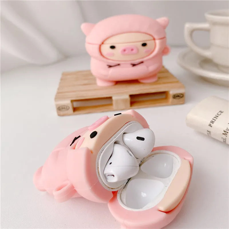Pink silicone AirPods case with cartoon pig design and hook attachment for AirPods 1, 2, and Pro