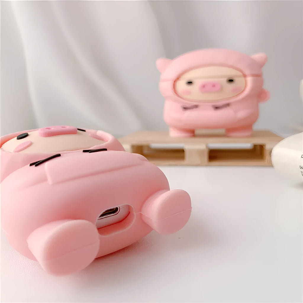 Pink silicone AirPods case with cartoon pig design and hook attachment for AirPods 1, 2, and Pro