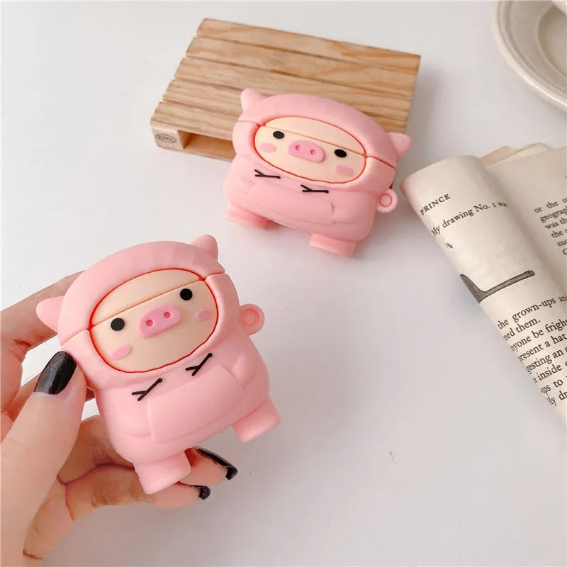 Pink silicone AirPods case with cartoon pig design and hook attachment for AirPods 1, 2, and Pro
