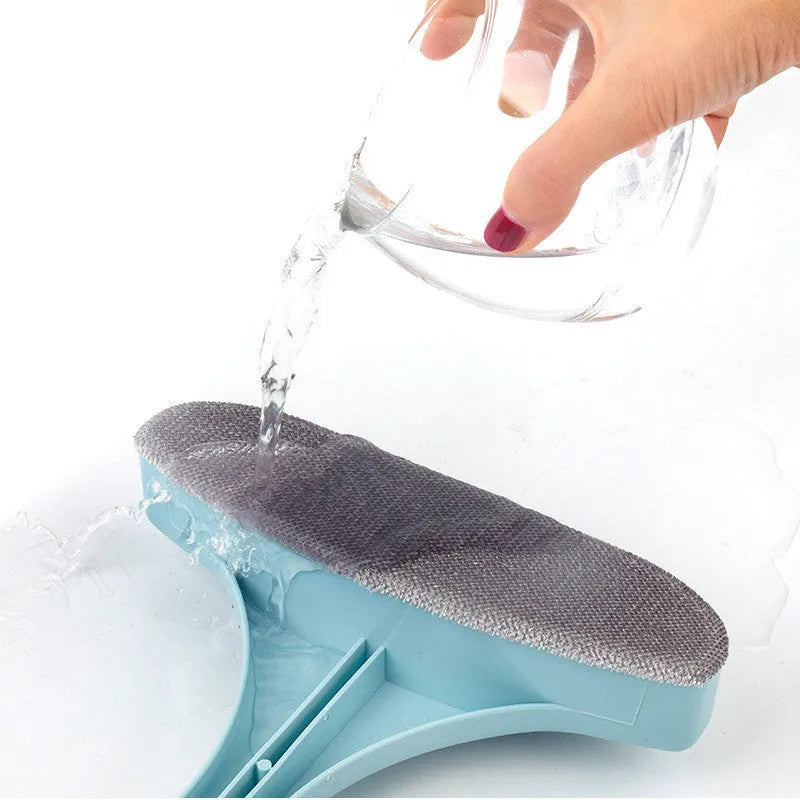 Blue window cleaning brush with double-sided sassafras head and a separate gap brush attachment on a white background.