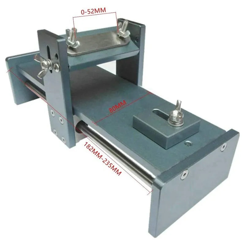 Aluminium alloy fixed angle sharpening tool for woodworking chisels and planer blades on a workbench.
