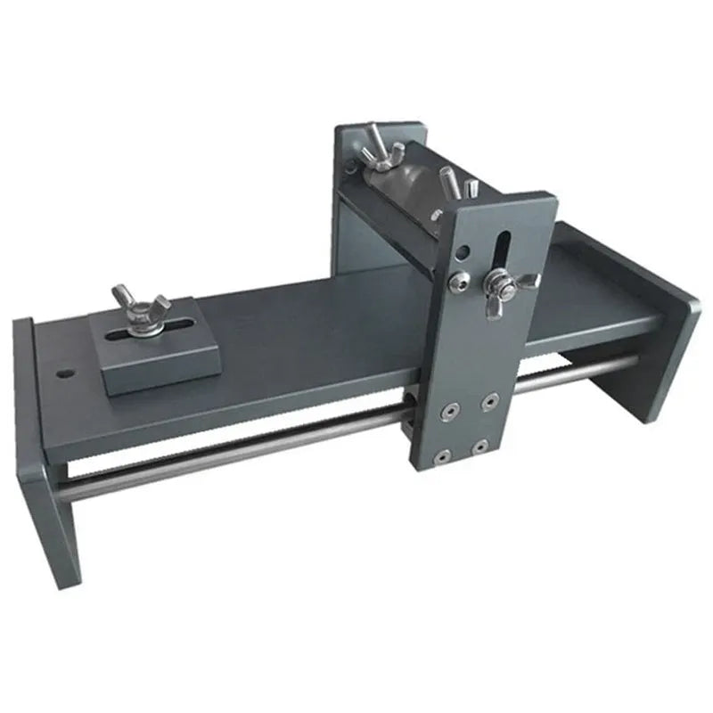 Aluminium alloy fixed angle sharpening tool for woodworking chisels and planer blades on a workbench.