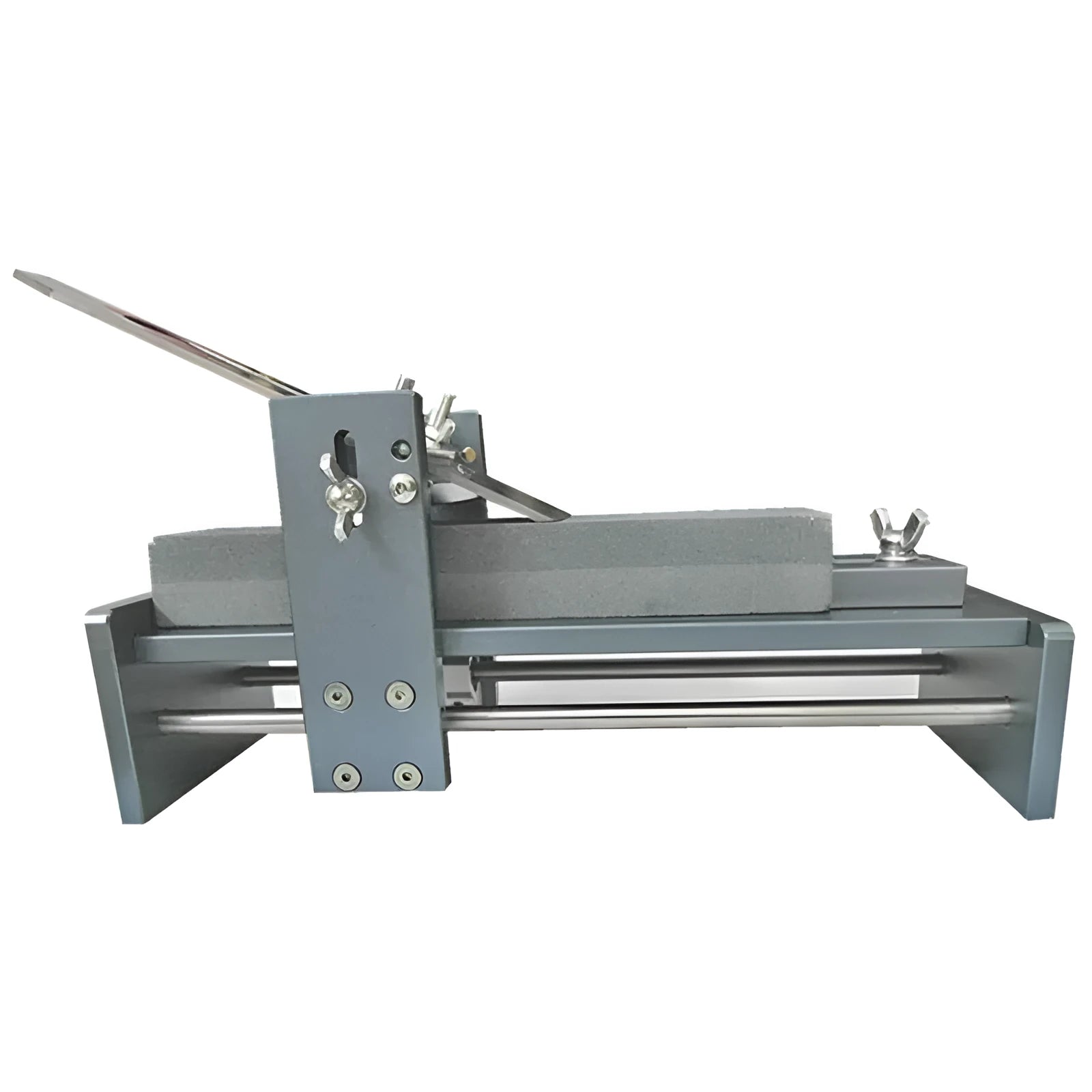 Aluminium alloy fixed angle sharpening tool for woodworking chisels and planer blades on a workbench.