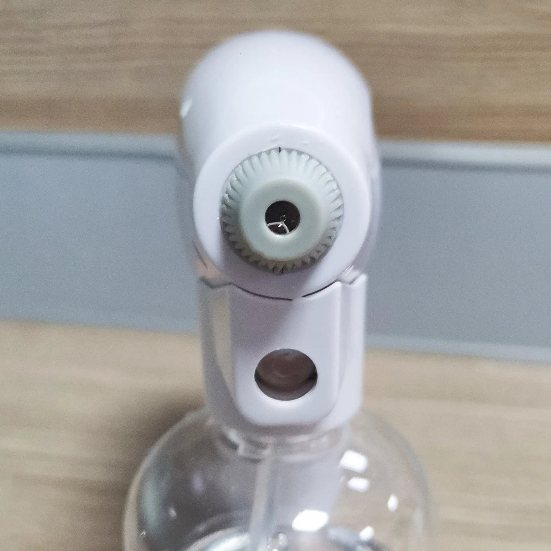 White handheld cordless electric spray gun with USB-C charging port and anti-clogging nozzle