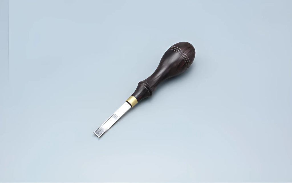 Leather hand tool for barbers with wide shovel edge thinning knife and drum shovel.
