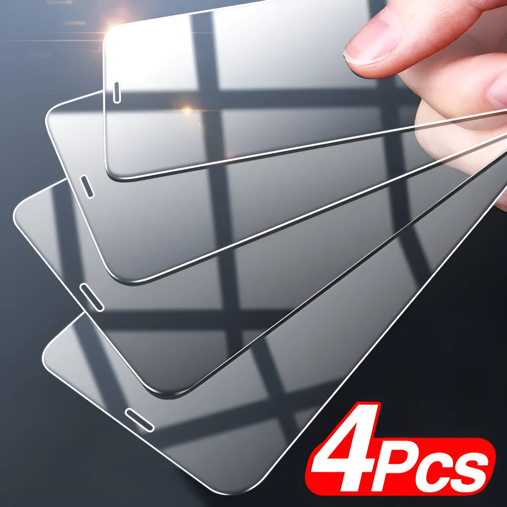 Four transparent tempered glass screen protectors for Apple iPhones on a white background.