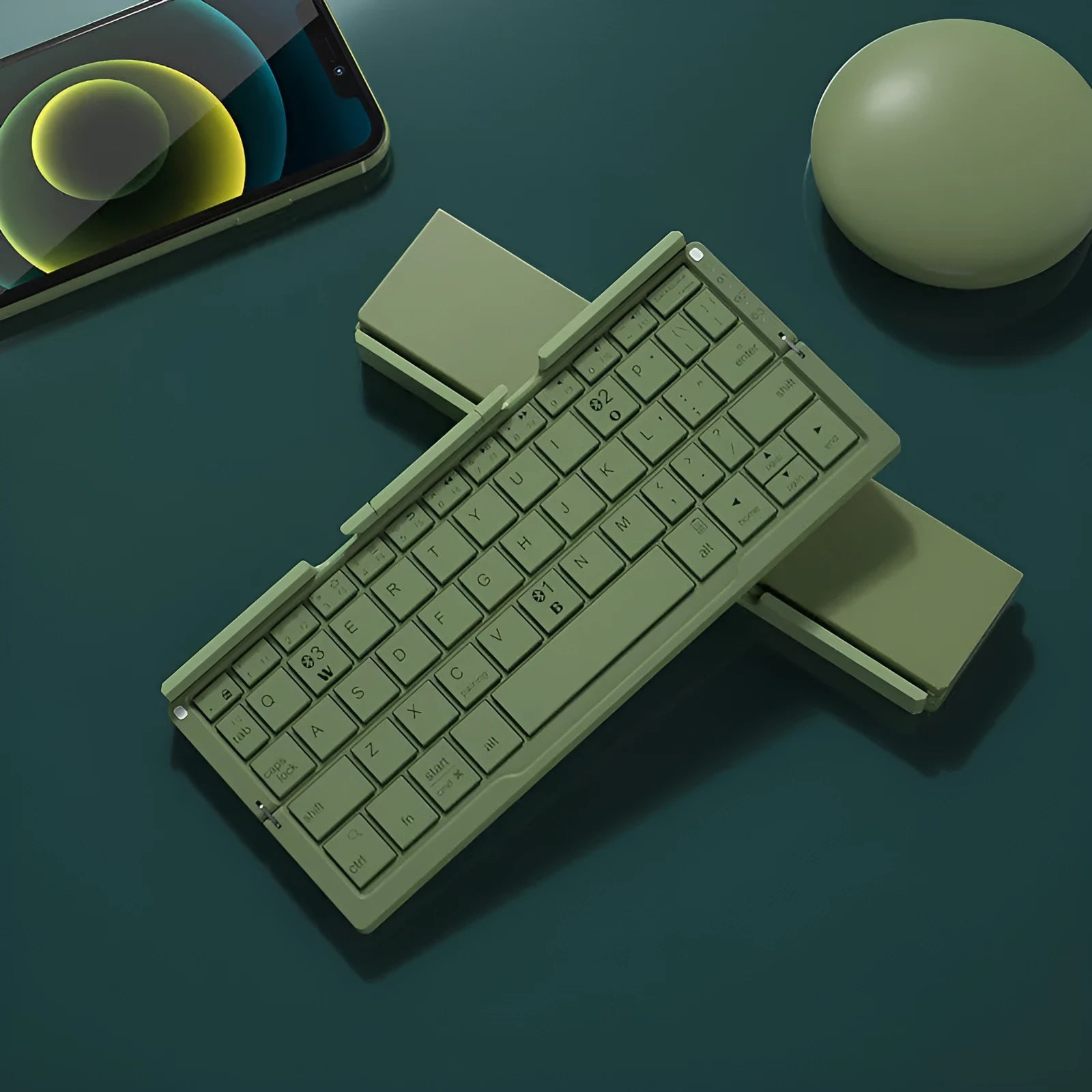 Silver white folding Bluetooth keyboard with built-in stand holding a tablet