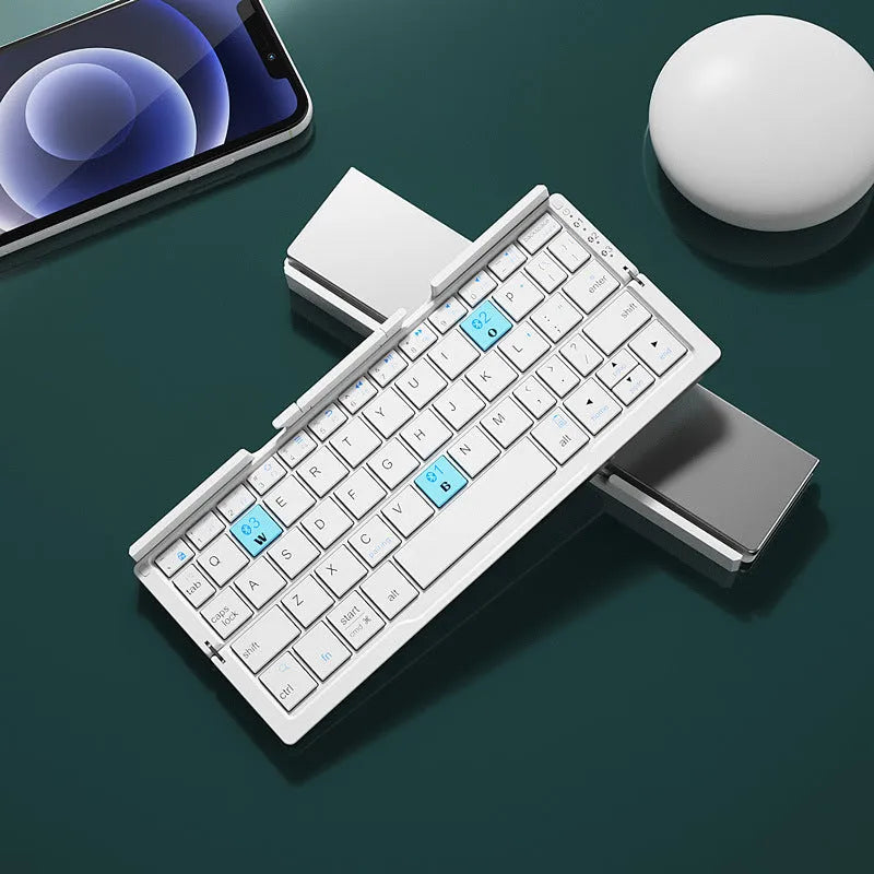 Silver white folding Bluetooth keyboard with built-in stand holding a tablet