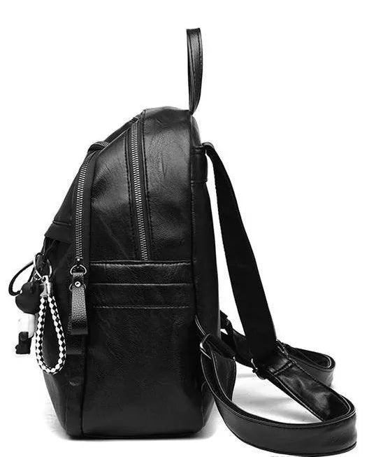 Black PU leather backpack with soft surface showing ID compartment and double luggage straps