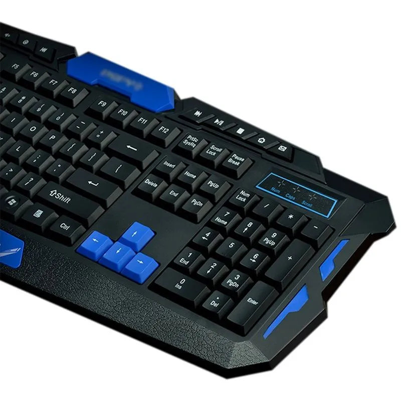Black and blue wireless keyboard and mouse set on a desk, showing their size and design.
