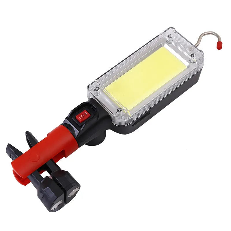 Red portable COB rechargeable flashlight with magnetic base, shown with USB charging cable.