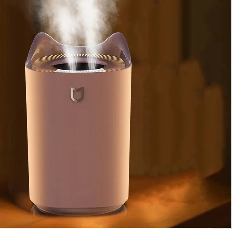 Double spray humidifier with three mist outlets in coral pink or glacier white colour