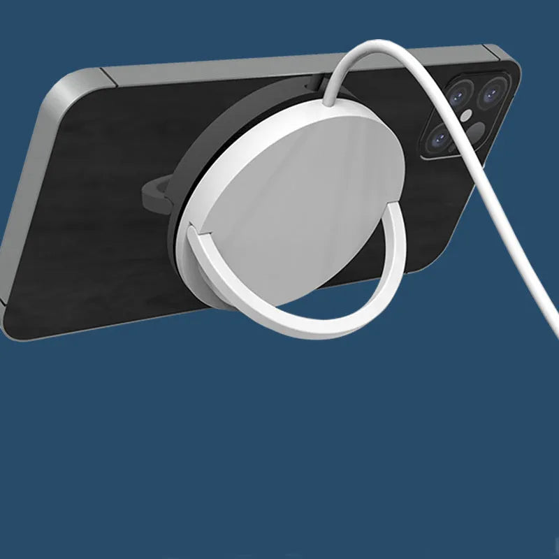 Black and white wireless phone charger with magnetic bracket showing Type-C port and charging surface