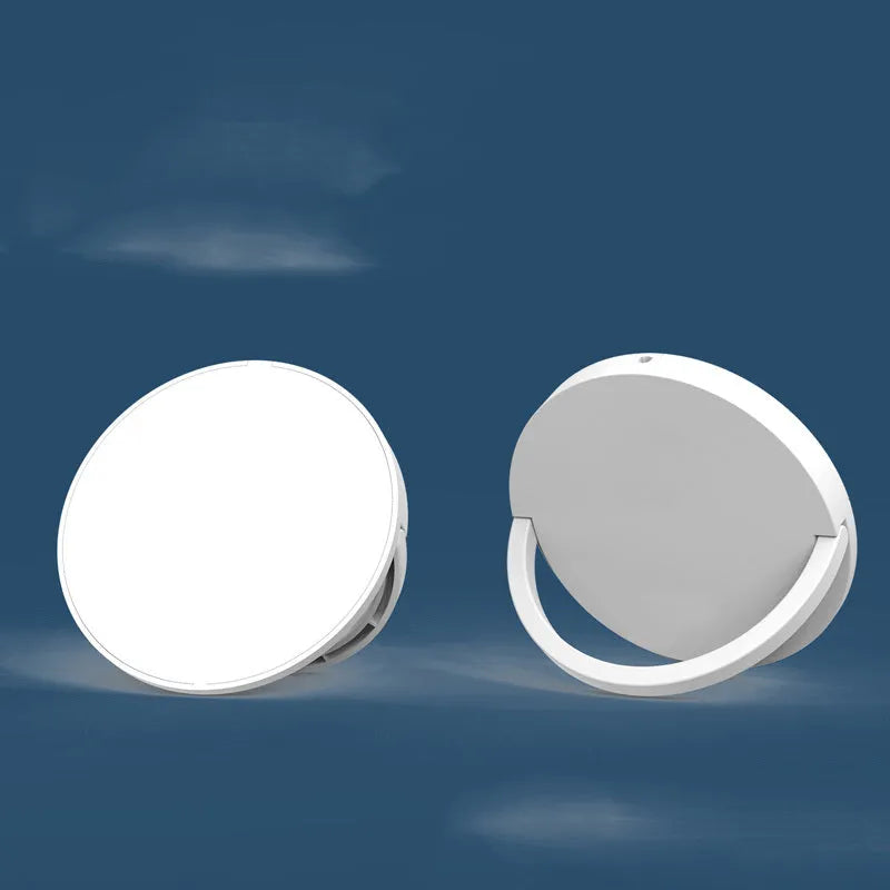 Black and white wireless phone charger with magnetic bracket showing Type-C port and charging surface