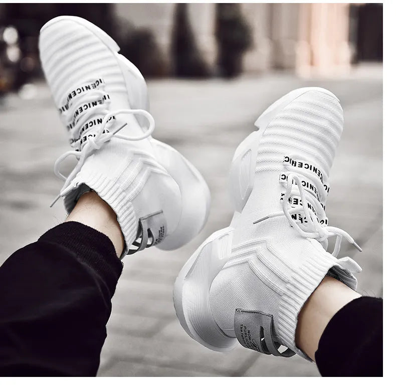 Men's black and white sports-style casual shoes with mesh lining, shown in large sizes.