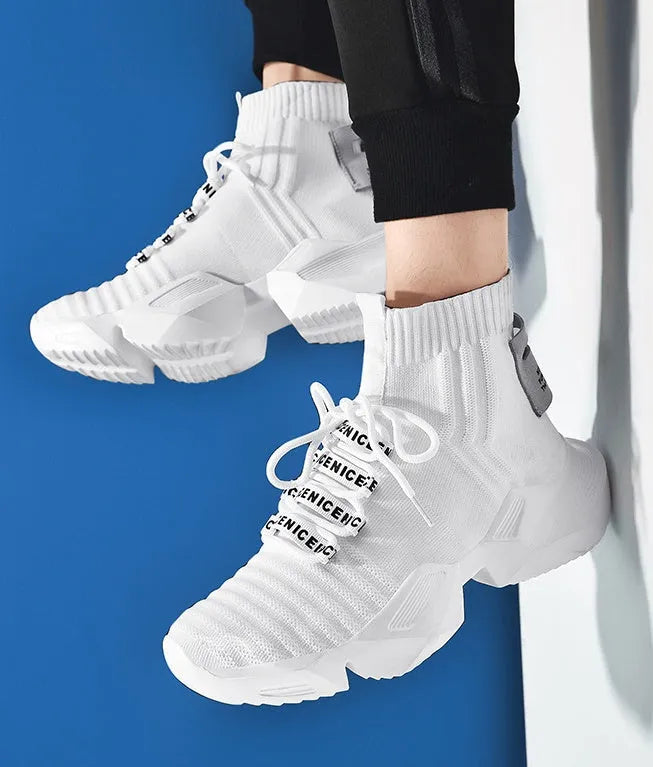 Men's black and white sports-style casual shoes with mesh lining, shown in large sizes.