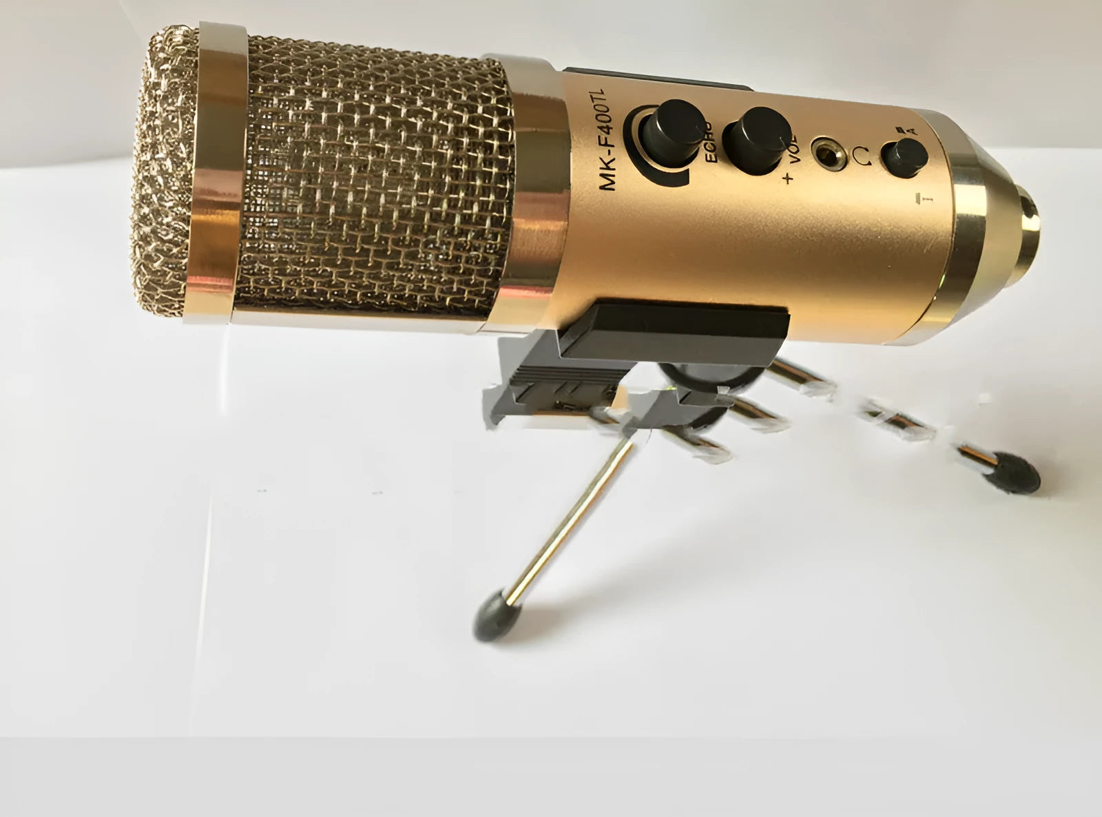 Gold wireless condenser microphone with integrated stand for mobile phones and computers