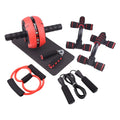 Green resistance bands and push-up bar abdominal fitness machine on a gym floor.