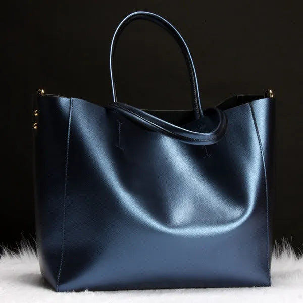 Women's cowhide leather shoulder bag with adjustable straps in bronze colour showing main compartment