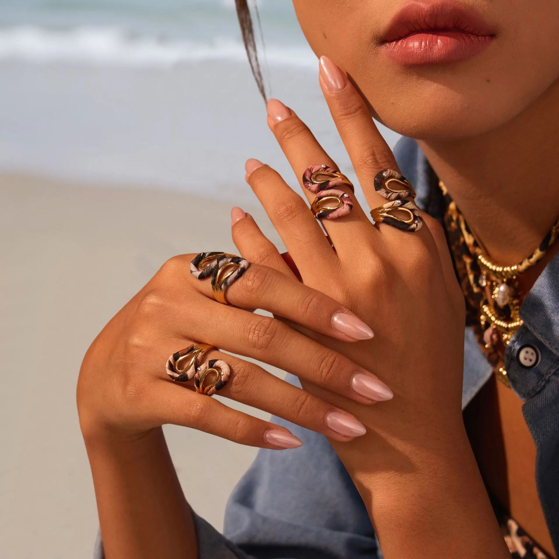 Geometric leopard print open mouth ring in stainless steel, shown in various colour options.