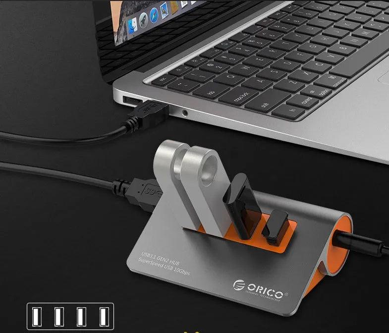 Dark grey and orange aluminium USB 3.1 hub with four ports and individual power switches