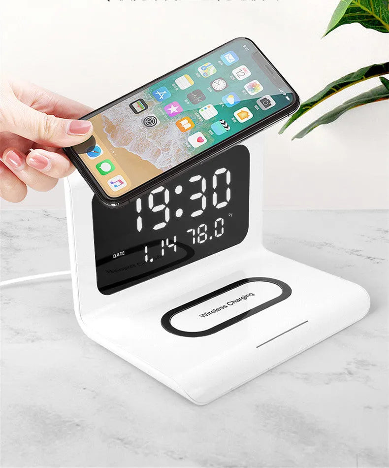 Wireless charger alarm clock with digital display showing time, date, temperature and humidity